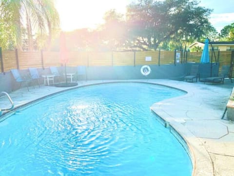 Sunny days in our private paradise! ☀️ Our fenced-in pool area features sun loungers and additional seating, with 2 pool umbrellas for the perfect shade. Dive into the fun with provided pool floats. Welcome to your exclusive poolside retreat!