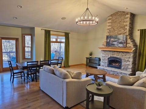 The open concept great room is a perfect place to gather, cook meals, and enjoy river views.