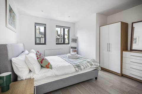 Thoughtfully designed for restful nights. Enjoy modern amenities and elegant decor in this bedroom at Stylish Bickley Home Near London.