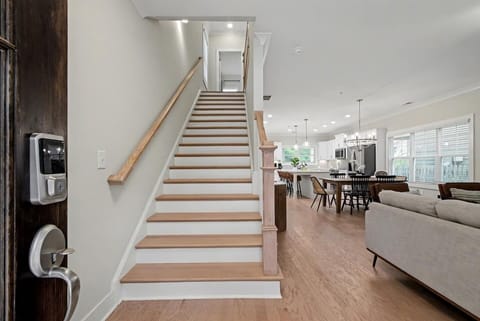 Smart lock entry makes check-in a breeze — step inside to a bright, open layout with seamless flow to kitchen, dining, and living areas.