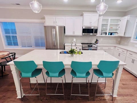 Gather around the spacious kitchen island for casual meals and conversation.