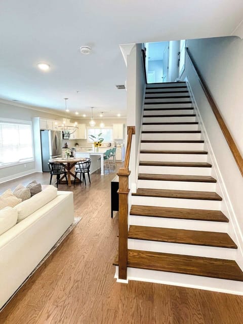 Welcoming entry with stairs leading to bedrooms and an open first floor that feels spacious and bright.