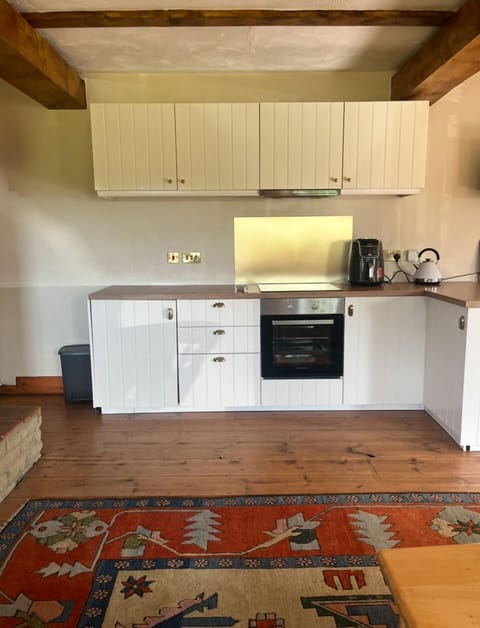 Kitchen, complete with oven, hob, fridge freezer, microwave and washing machine.