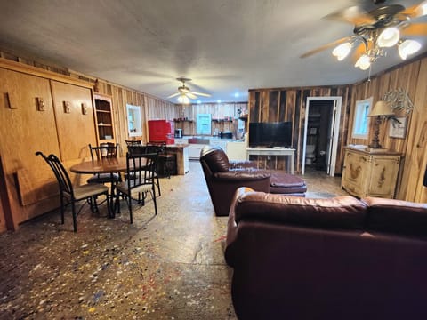 Open living room with murphy bed and dining table 