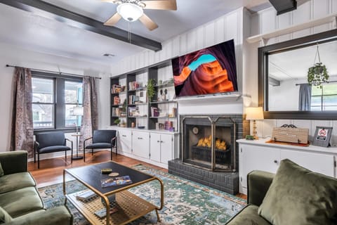 Roku TV
Velvet Ashley Couches
Eclectic Book Collection 
Games & More

This living room is perfectly suited for all types of guests. Unwind & relax after exploring, working, or traveling.