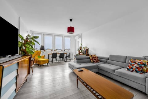 Living Room with Large Smart TV and Full Sofa Bed | Book Now with RENTUJEMY.COM
