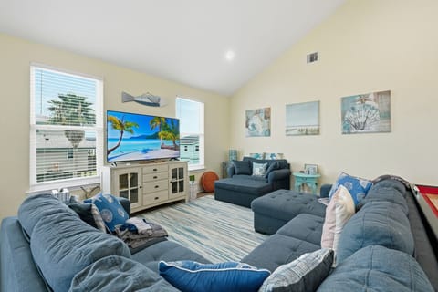 Living Room | Spacious Open-concept Layout with Vaulted Ceilings, Sectional Sofa, and Natural Light