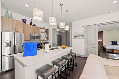 The ultimate 30A gathering spot. This modern, open-concept kitchen and dining area is perfectly designed for hosting family dinners and making memories near Rosemary Beach.