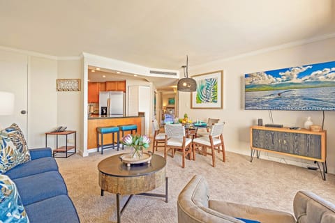 A view of the spacious open floor plan, combining the cozy living room with the full dining area. Perfect flow for your vacation meals