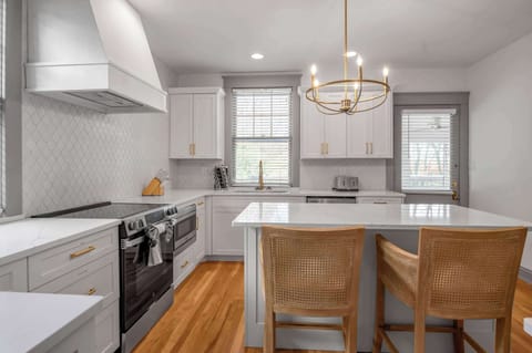Beautifully arranged kitchen offering seamless functionality, quality finishes, and a warm atmosphere that makes meal prep a pleasure.
