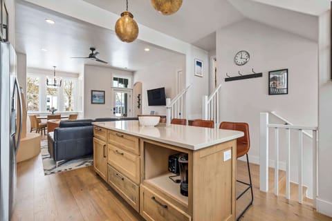 This angle highlights the oversized kitchen island that anchors the main floor, offering storage, seating, and a smooth connection to the living room. It’s an ideal layout for cooking, gathering, or hosting.