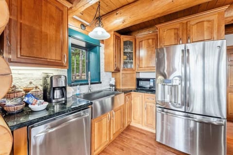 Step into your fully-equipped kitchen with gleaming stainless steel appliances, warm wood cabinetry, and everything you need for memorable meals.