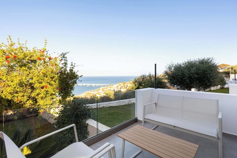 rivate Terrace with Panoramic Sea Views and Outdoor Seating
Elevated balcony offering a wide, uninterrupted view of the coastline and surrounding greenery.