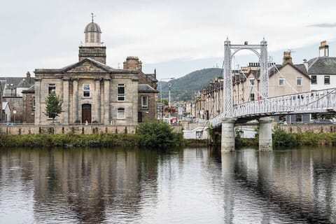 Belltower old church and Victorian suspension bridge to historic city centre