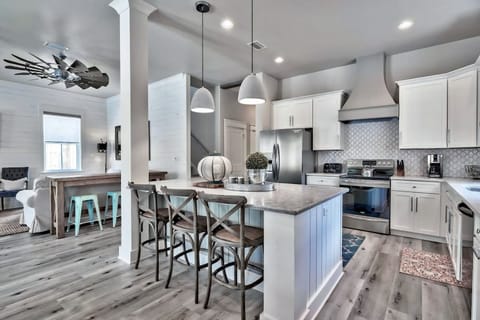 A spacious kitchen designed for gathering, cooking, and easy conversation.