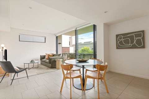 A round timber dining table set for four brings a sense of connection, perfect for sharing meals or using as a dedicated workspace.