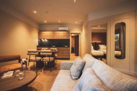 A warm and inviting lounge where soft lighting and natural textures create the perfect retreat after a day by the ocean.