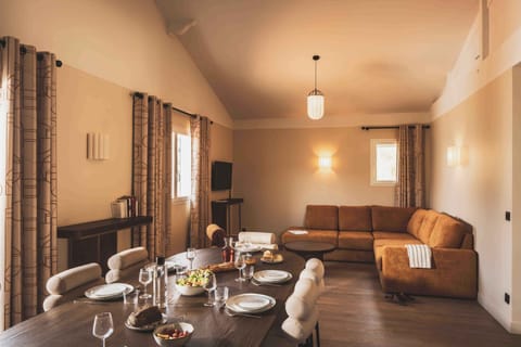 A bright and spacious living area filled with natural light — perfect for relaxing or sharing meals together.