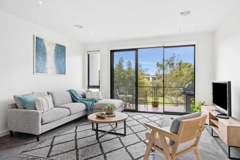 Light Filled living room with terrace to enjoy a BBQ