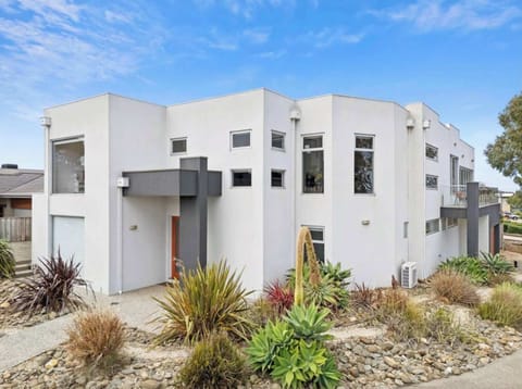 Beautifully appointed six-bedroom beachside home with sea views, perfectly positioned in a quiet coastal pocket just moments from the surf and sand.