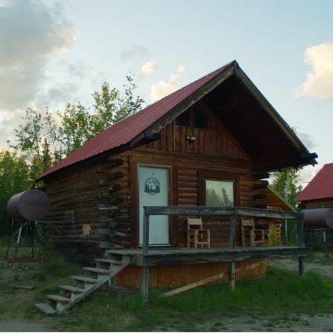 Charming rustic log cabin with private porch and peaceful woodland setting