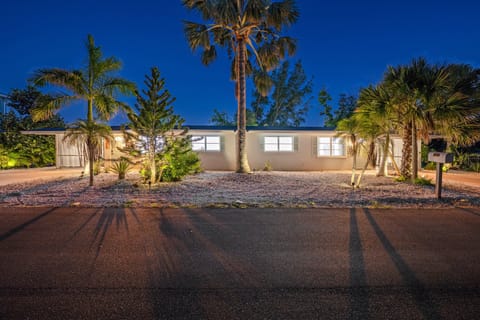 Behold your entire Longboat Key compound illuminated by the twilight glow, ready to host your group vacation in style.