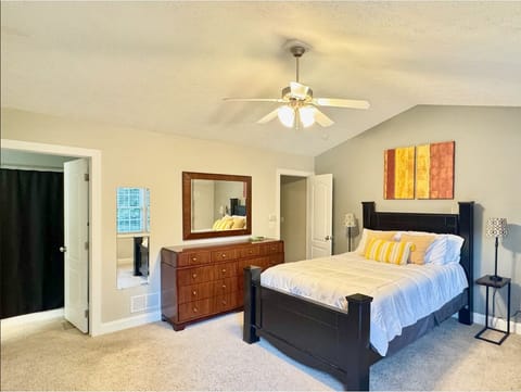 Cozy and well-lit bedroom designed for a restful night’s sleep.