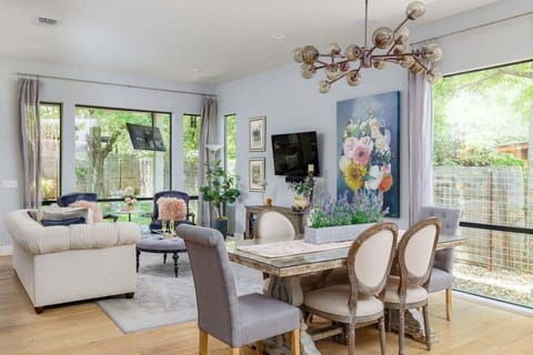 The Watson - open floor plan with a large living room, smart TV, & a music room