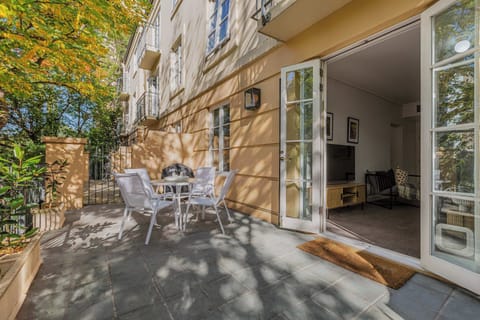 Oversized private balcony with a BBQ and seating area