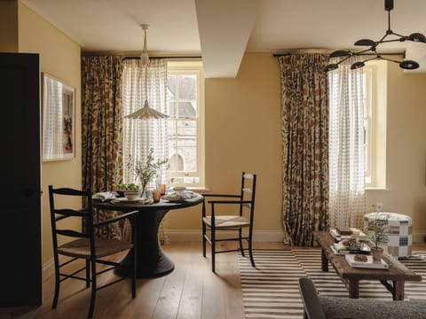 Bright dining area with views over Stow`s rooftops, ideal for breakfast or evening drinks
