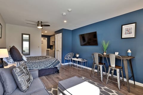Cozy studio at Killington Center Condos. Plush queen bed, sleeper sofa, smart TV, kitchenette, and counter-height table to enjoy your meals.