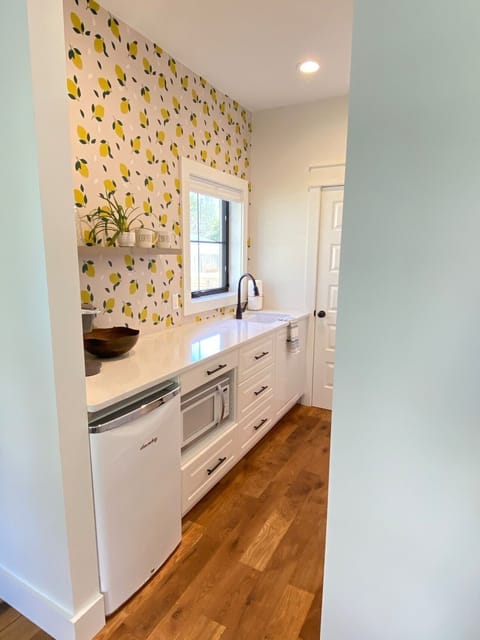 butlers kitchen- near main floor bedroom. Door leads to main kitchen. 