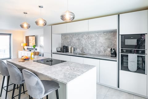 Ground floor: A well-equipped fitted kitchen with island/breakfast bar
