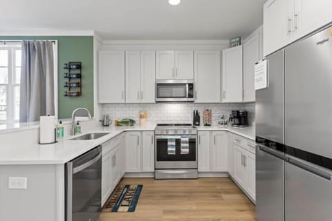 A fully equipped kitchen with stainless steel appliances and tons of extras and perks!