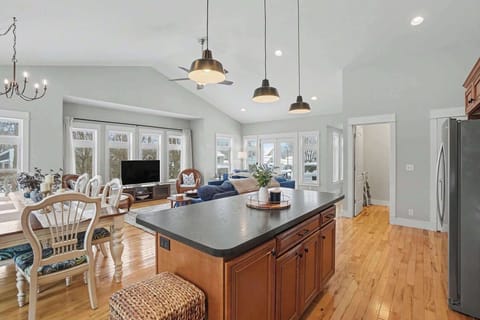 A chef's dream featuring a massive granite island, perfect for a casual breakfast or evening appetizers.