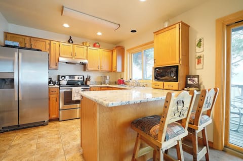 Kitchen has full size refrigerator, range and dishwasher.