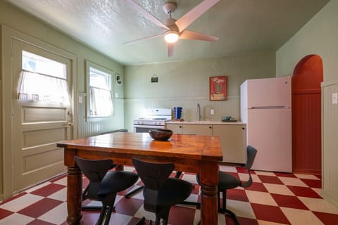 Retro kitchen with a classic checkered floor and dining table.