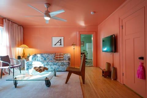 Bright living room with colorful walls and cozy seating.