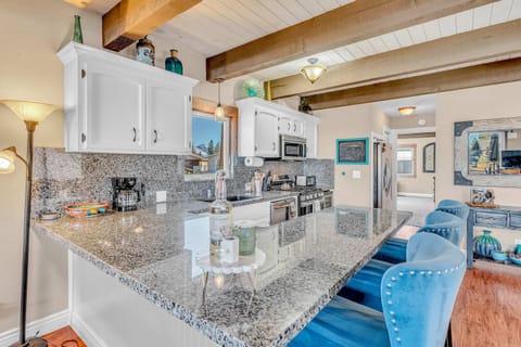 Kitchen: Drip coffee maker, toaster oven, cooking utensils, tableware