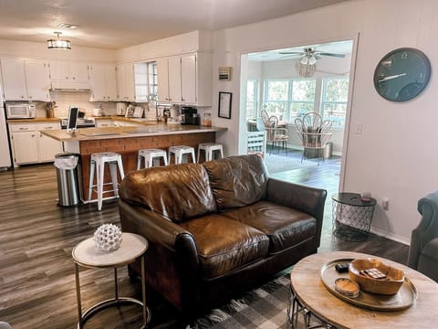 Open concept living room, dining area, and fully stocked kitchen