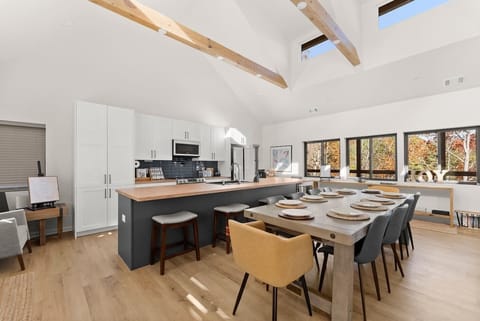 Spacious dining table with extensions available to host up to 14 guests