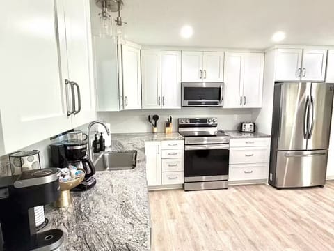 Fully stocked kitchen with coffee bar