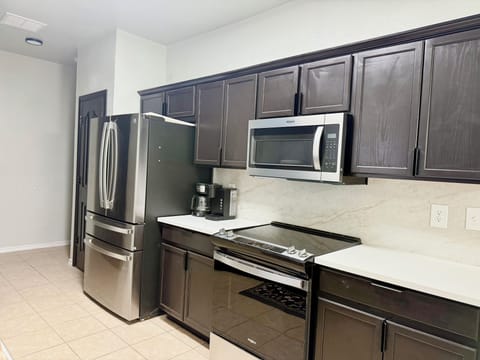 Equipped with sleek steel appliances to make every culinary moment feel special.