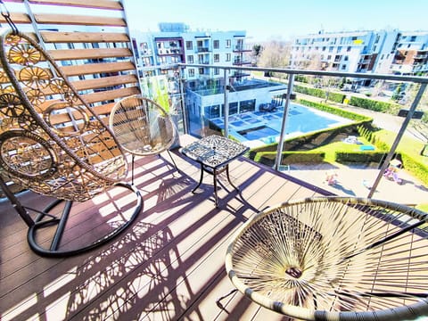 Apartment, Furniture, Residential Area, Condominium, Balcony, Urban Design, Outdoor Furniture, Mixed-Use, Chair, Leisure