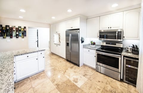 Kitchen opens to dining room, living room, and hallway