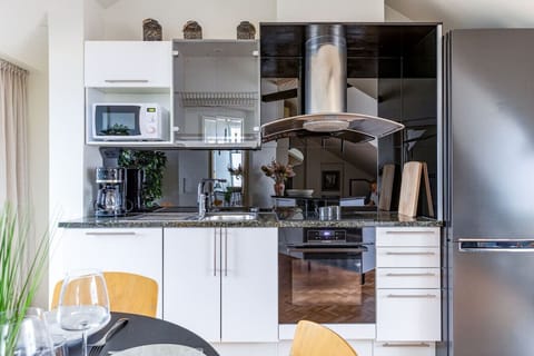 Bright, simple kitchen with modern appliances and everyday essentials. Clean counters and light finishes make it easy to cook, enjoy coffee, or have a quiet meal at home.