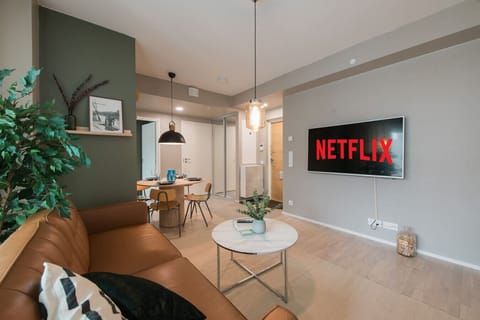 Relax in this stylish Helsinki living room, featuring a bluetooth speaker, smart TV and Netflix for endless entertainment. Whether you`re streaming or just recharging, this is your spot.