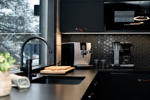 Bright and functional kitchen space featuring a stylish sink and contemporary faucet.