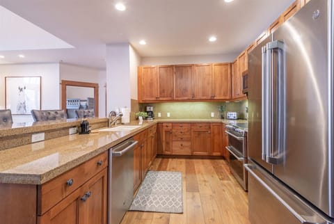 Your dream kitchen awaits with warm wood cabinetry, gleaming granite countertops, and top-of-the-line stainless steel appliances. Cook with ease while enjoying the open flow to your living space.