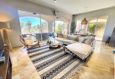 Bright and spacious living room with cozy sectional sofa and stylish coastal decor.